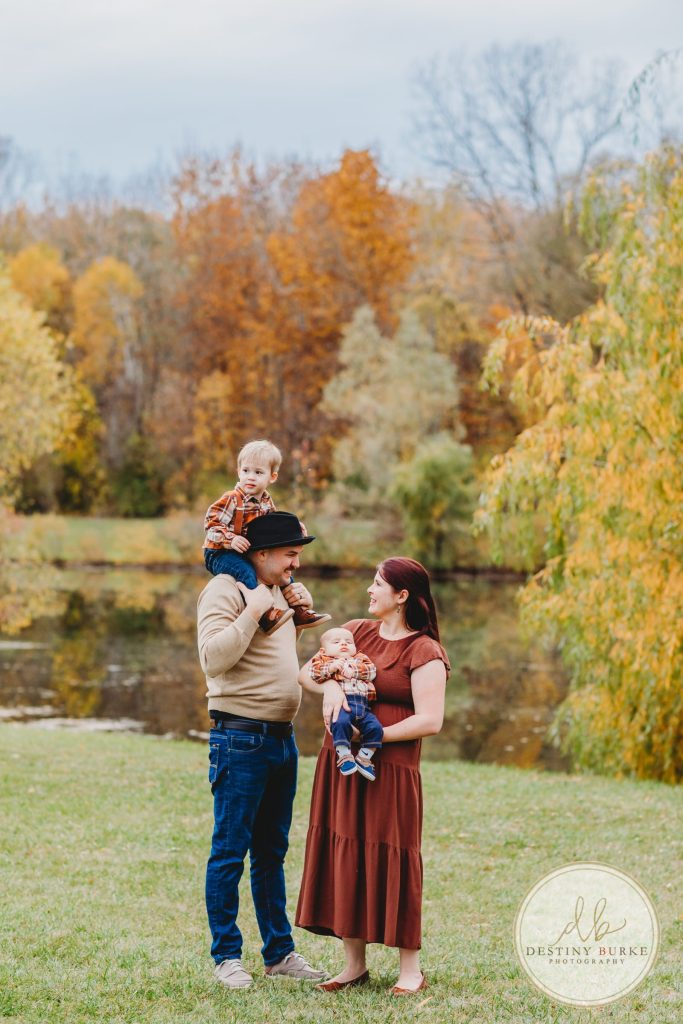 Best family photographer near Rochester, NY, family photography session in the fall, extended family portrait session in Chili, NY, family of four, Black Creek Park,