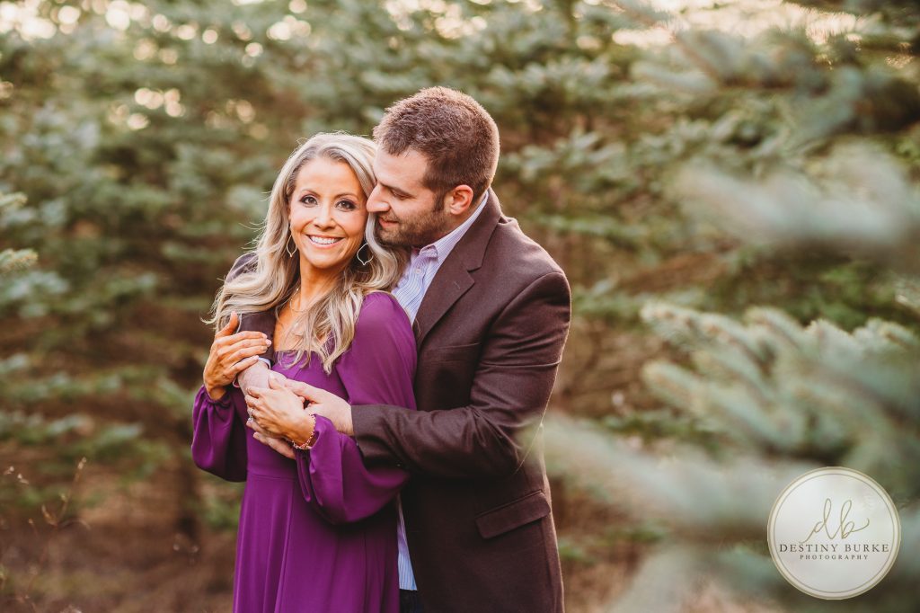 Husband and Wife Couples Photography Session at tree farm near Rochester, NY, in LeRoy at McPherson Orchards tree farm.