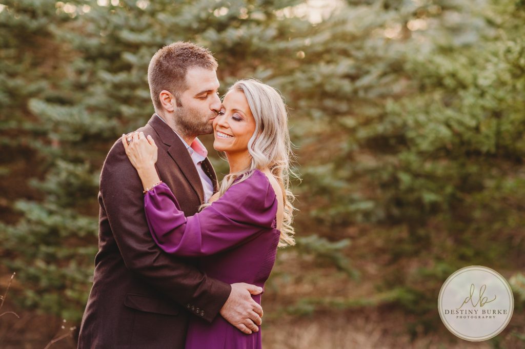 Husband and Wife Couples Photography Session at tree farm near Rochester, NY, in LeRoy at McPherson Orchards tree farm.