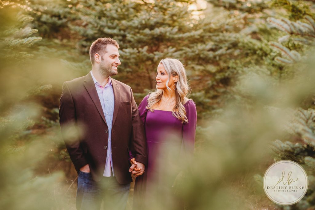 Husband and Wife Couples Photography Session at tree farm near Rochester, NY, in LeRoy at McPherson Orchards tree farm.