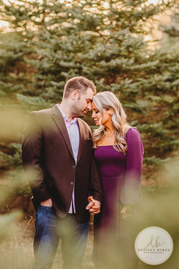 Husband and Wife Couples Photography Session at tree farm near Rochester, NY, in LeRoy at McPherson Orchards tree farm.