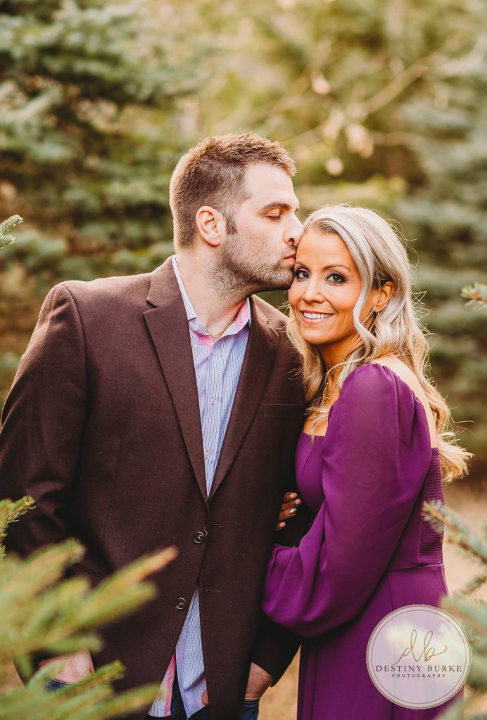 Husband and Wife Couples Photography Session at tree farm near Rochester, NY, in LeRoy at McPherson Orchards tree farm.