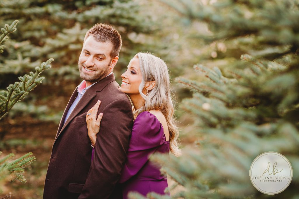 Husband and Wife Couples Photography Session at tree farm near Rochester, NY, in LeRoy at McPherson Orchards tree farm.