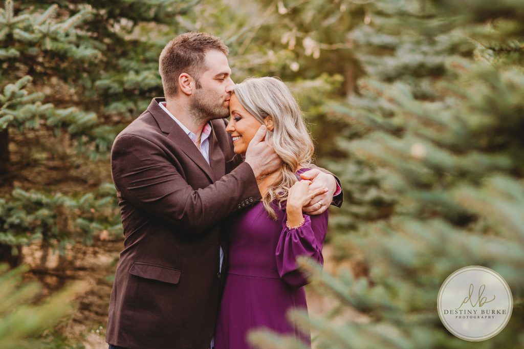 Husband and Wife Couples Anniversary Photography Session at tree farm near Rochester, NY, in LeRoy at McPherson Orchards tree farm.
