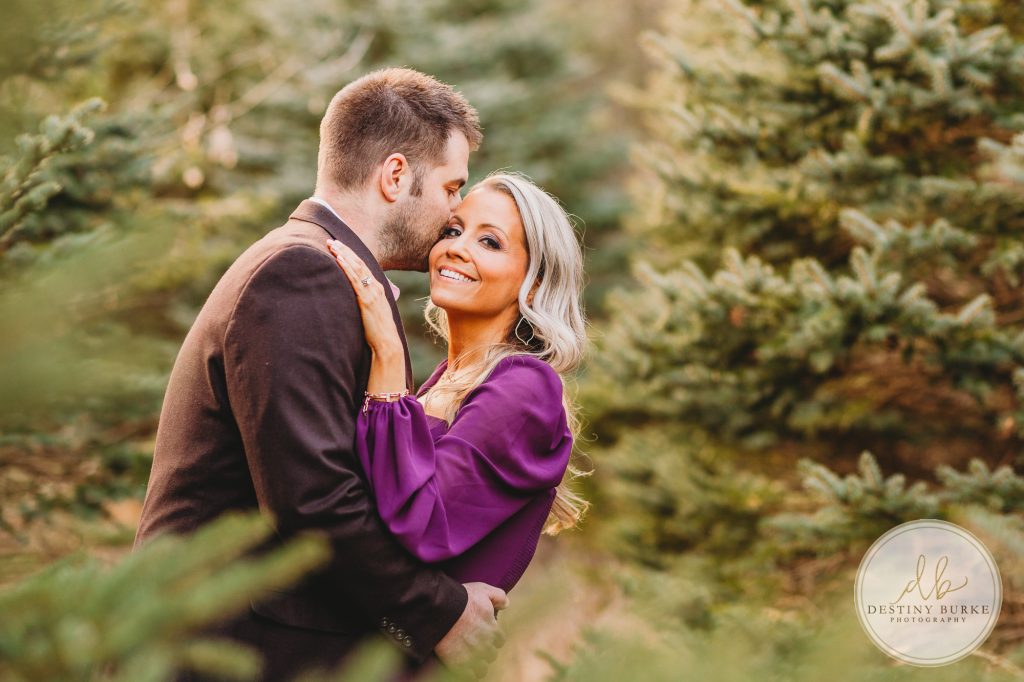 Husband and Wife Couples Anniversary Photography Session at tree farm near Rochester, NY, in LeRoy at McPherson Orchards tree farm.