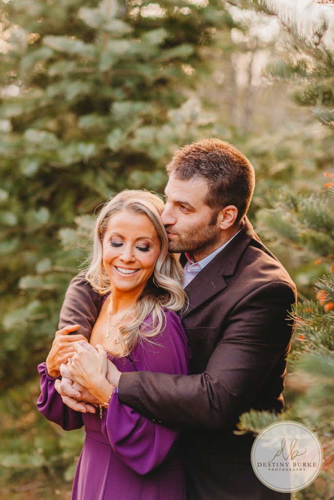 Husband and Wife Couples Anniversary Photography Session at tree farm near Rochester, NY, in LeRoy at McPherson Orchards tree farm.