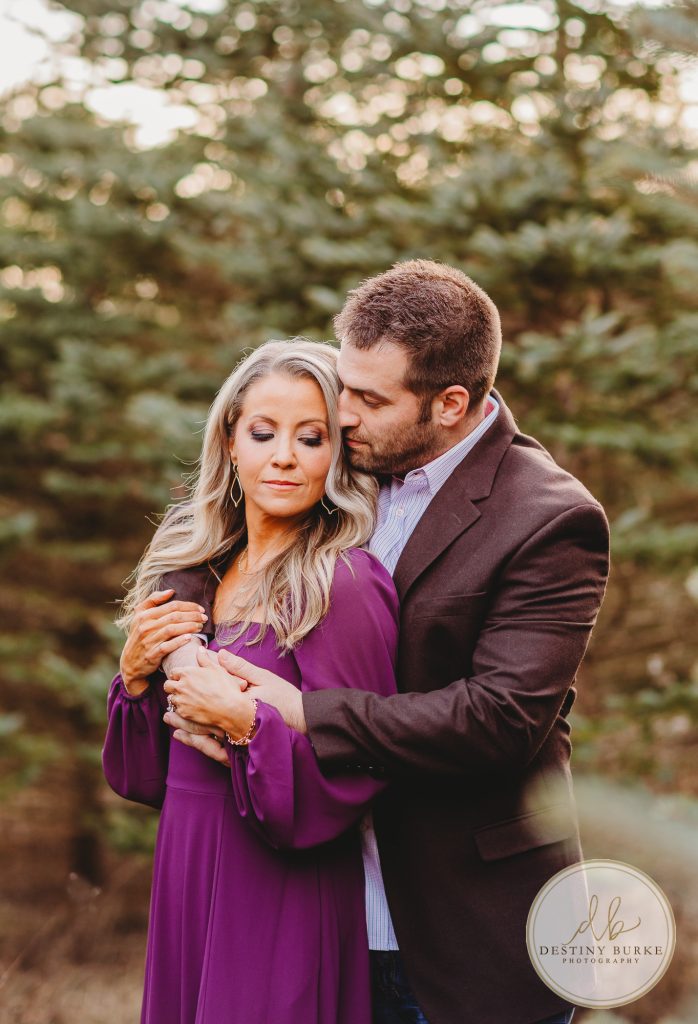 Husband and Wife Couples Photography Session at tree farm near Rochester, NY, in LeRoy at McPherson Orchards tree farm.