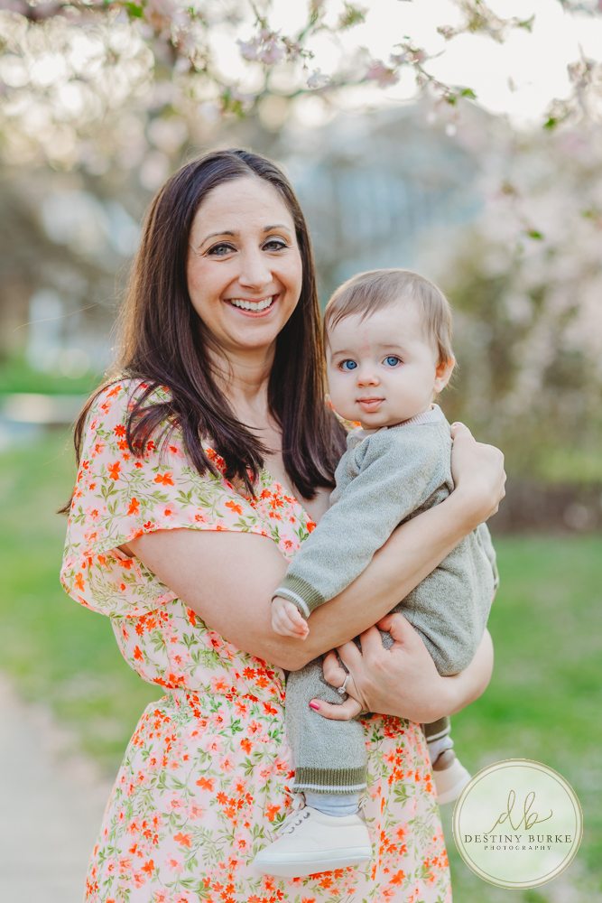 best family photographer near Rochester, NY, at Highland Park, family of 4 under the Cherry Blossom trees, photographed by Caledonia photographer, Destiny Burke Photography at sunset.