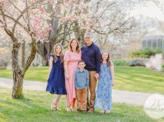 best family photographer near Rochester, NY, at Highland Park, family of 5 under the Cherry Blossom trees, photographed by Destiny Burke Photography at sunset.