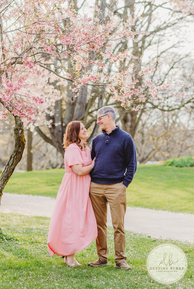 best family photographer near Rochester, NY, at Highland Park, family of 5 under the Cherry Blossom trees, photographed by Destiny Burke Photography at sunset.