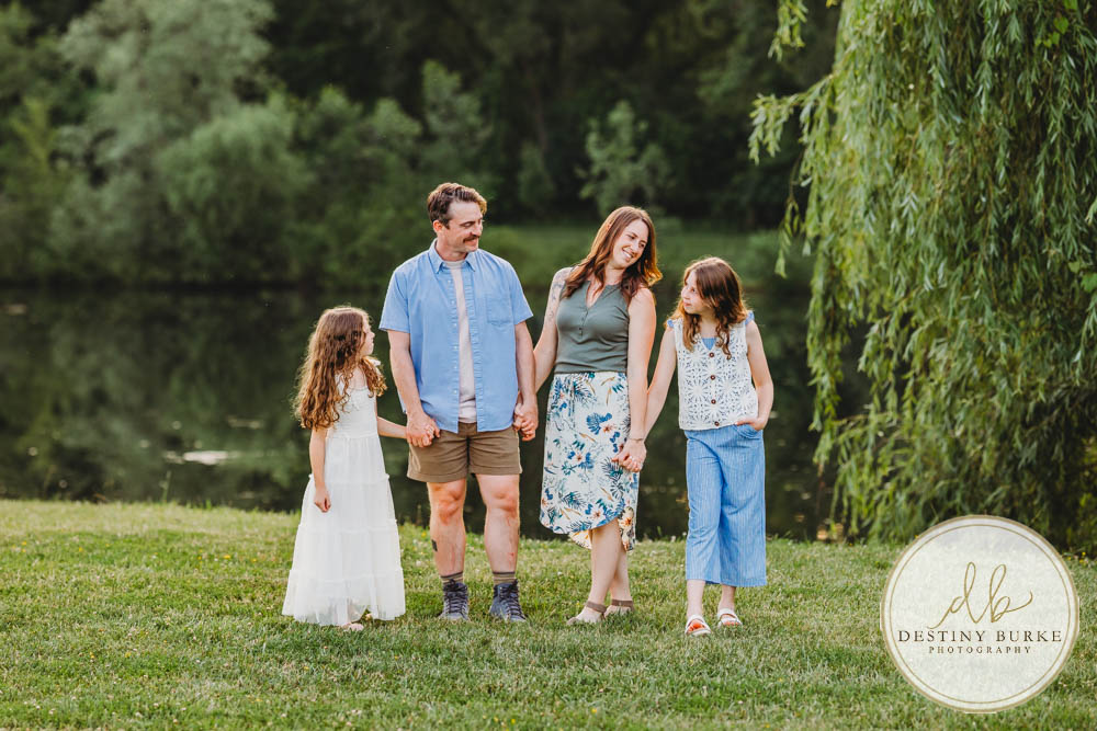 Generational family portrait of the Landry Family captured outdoors in Upstate NY with natural golden light and heartfelt connection, by Rochester photographer Destiny Burke.