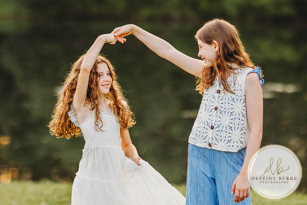 Generational family portrait of the Landry Family captured outdoors in Upstate NY with natural golden light and heartfelt connection, by Rochester photographer Destiny Burke.