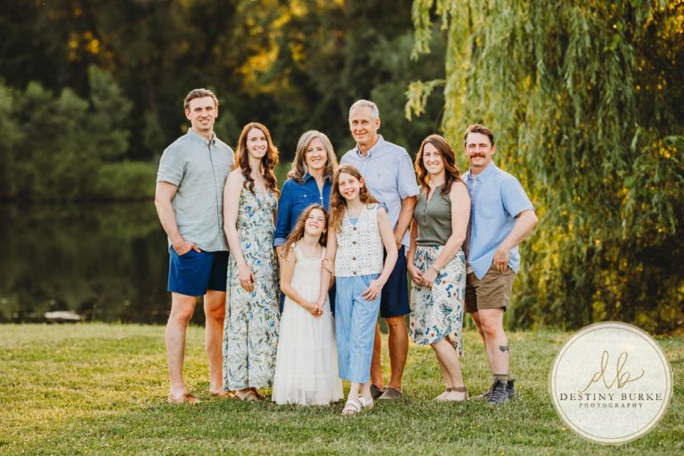 Generational family portrait of the Landry Family captured outdoors in Upstate NY with natural golden light and heartfelt connection, by Rochester photographer Destiny Burke.
