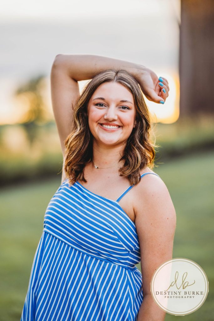 Golden hour extended family photo of the Carson/Ingersoll family in Caledonia, NY, featuring parents, grandparents, and their smiling young child. Captured by Destiny Burke Photography with warm light, candid emotion, and timeless connection.