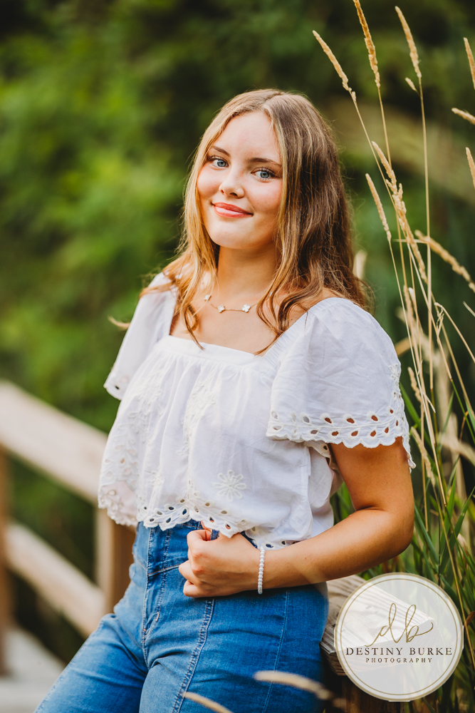 Natural Light Senior Photo of Sienna Laughing During Sunset Senior Portrait Session in Upstate New York, Rochester, Pittsford.