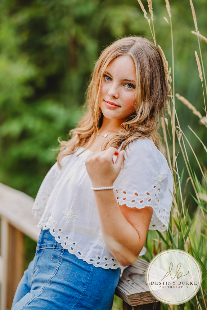 Natural Light Senior Photo of Sienna Laughing During Sunset Senior Portrait Session in Upstate New York, Rochester, Pittsford.