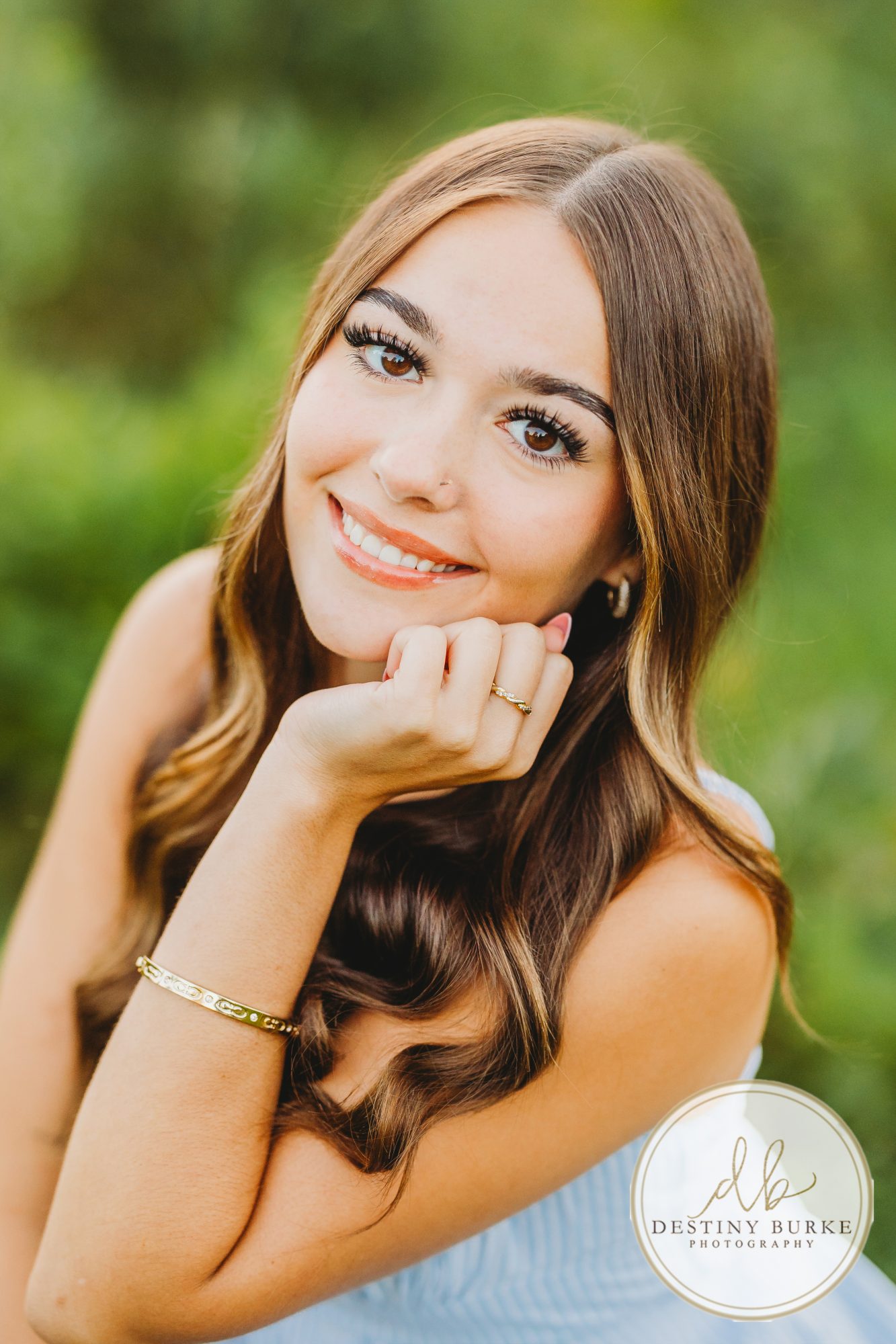 best Senior Portrait Photographer near Rochester, NY at Tinker Park with wildflowers at sunset golden hour